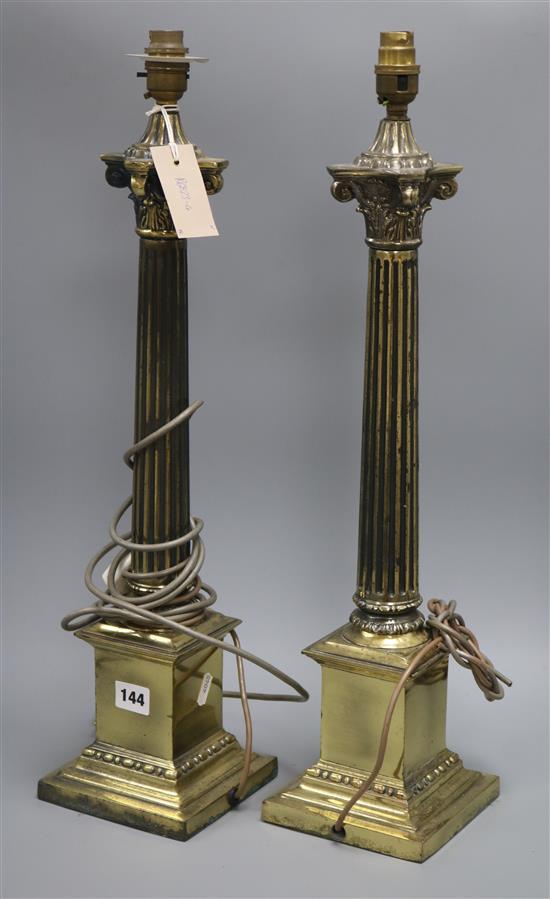 A pair of brass column brass lamps height 59cm
